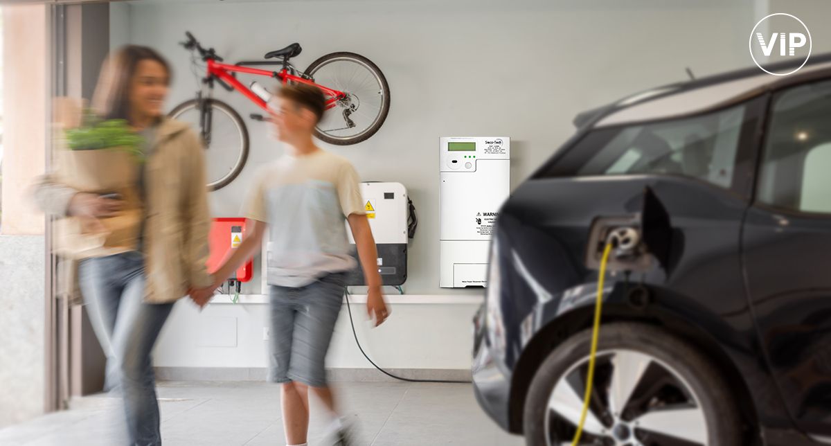 A tenant in a housing unit garage with a sub-meter in the background wall.